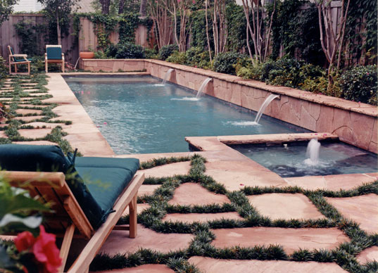 pool with scuppers and flagstone mondo grass decking
